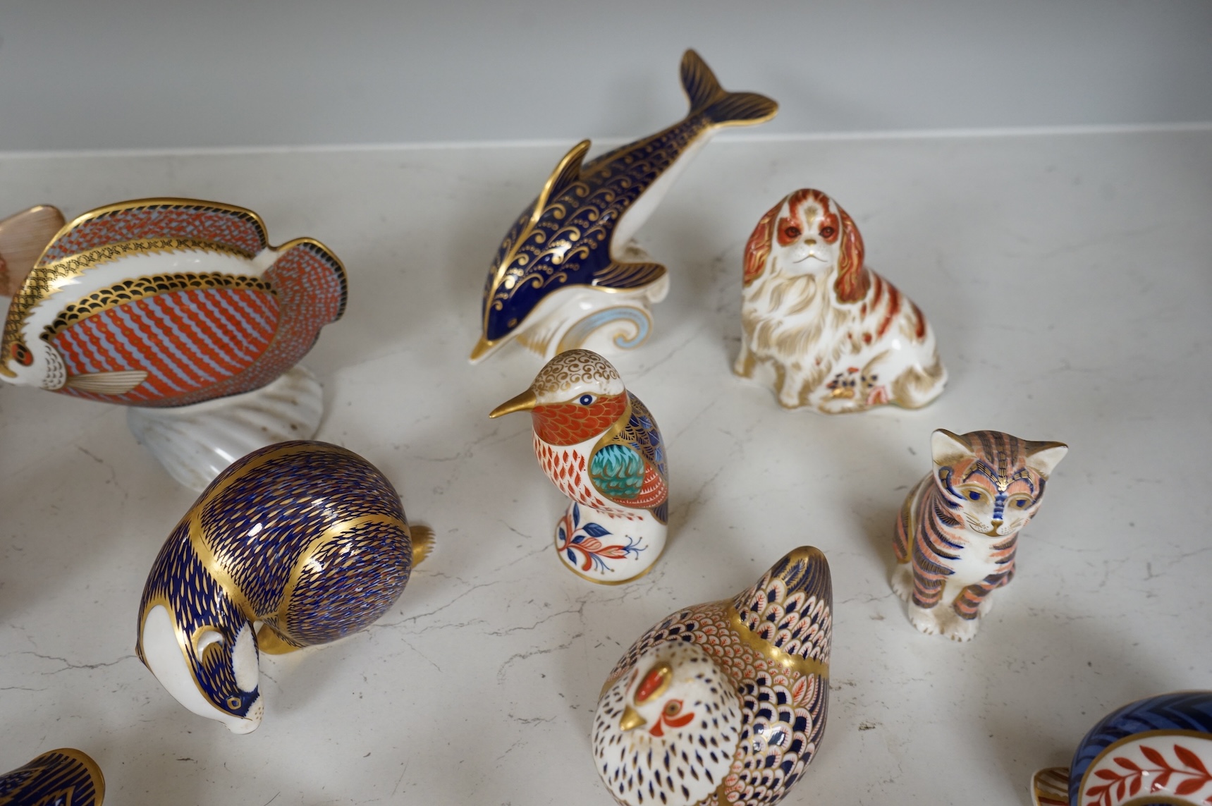 A collection of Royal Crown Derby Imari animal paperweights to include cats, fish and birds, largest 14cm high